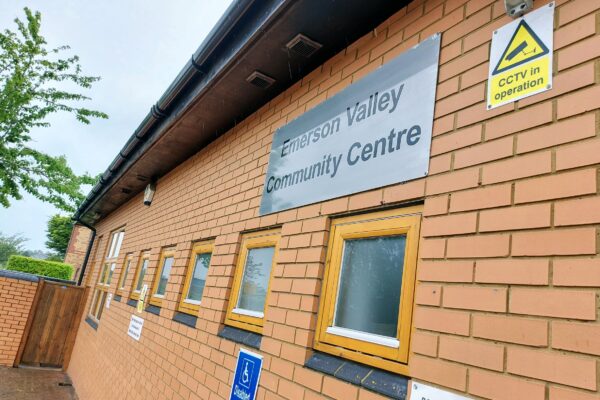 Close view of Emerson Valley Community Centre wall sign