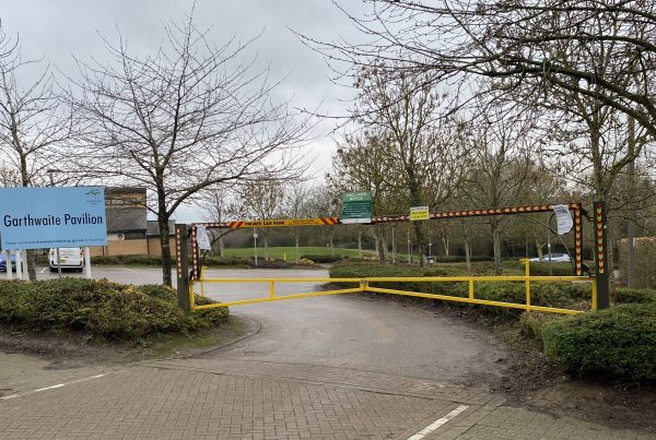 Yellow barrier with associated signage across entrance to Garthwaite Pavilion car park
